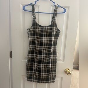 Plaid jumper.  The tags are cut out but it fits like a small.